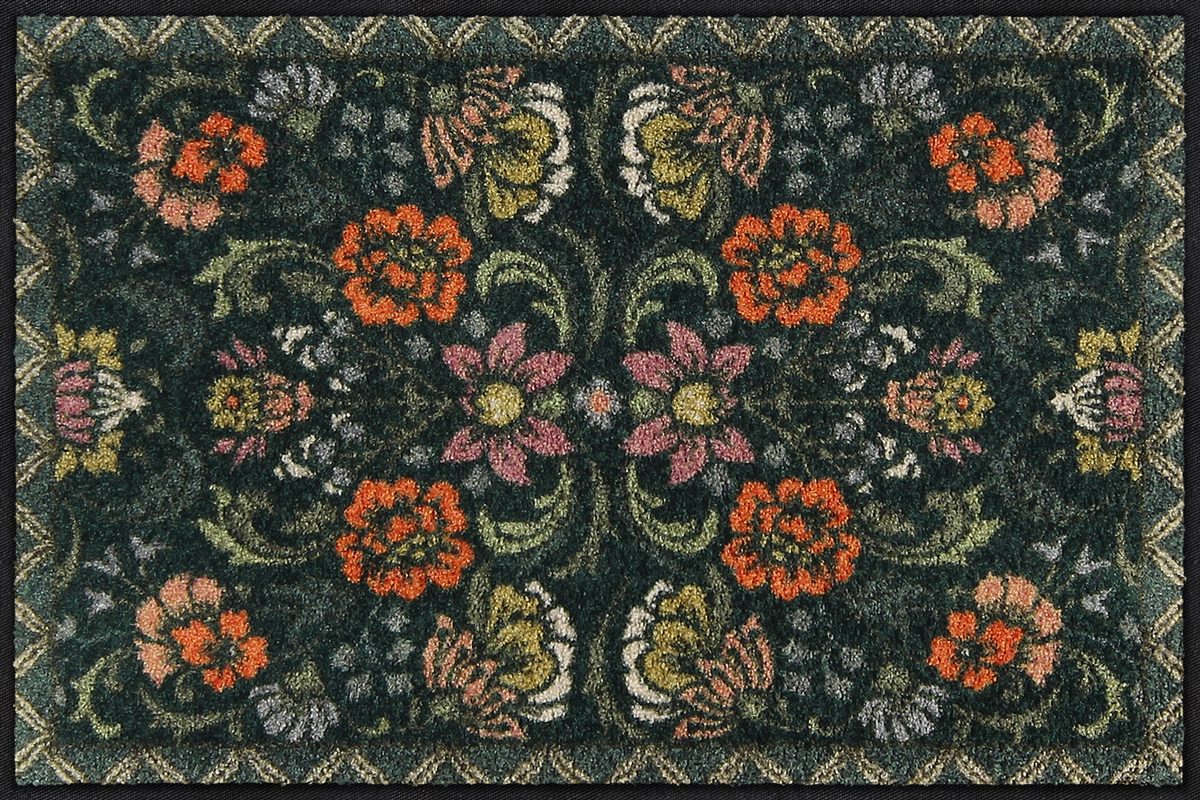 Salonloewe Fußmatte mit symmetrischem Blumenmuster auf dunkelgrünem Hintergrund