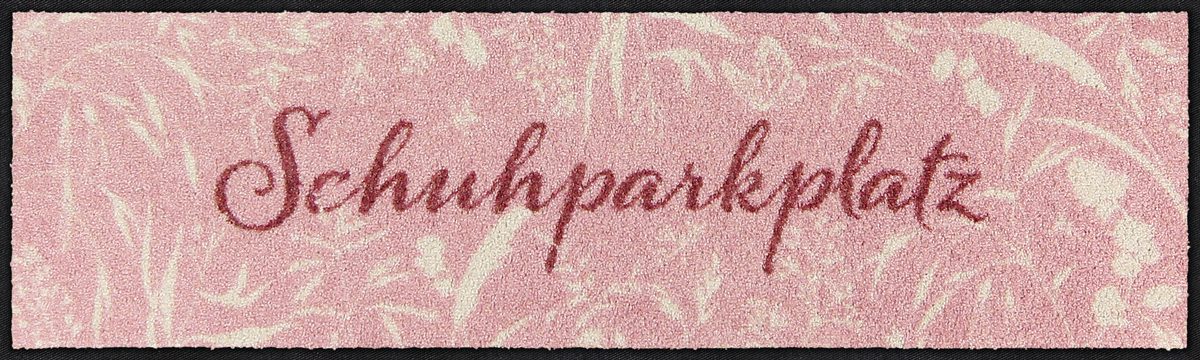 Salonloewe Schuhparkplatz mit Schriftzug und cremefarbenen Gräsern auf rosa Hintergrund