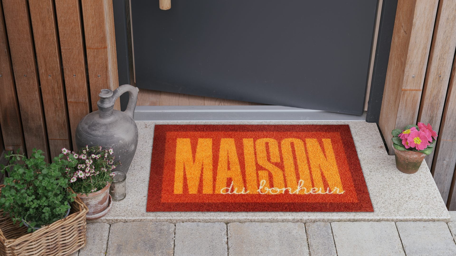Salonloewe Fußmatte mit Schriftzug „Maison du bonheur“ in Orange und Dunkelrot ambiente