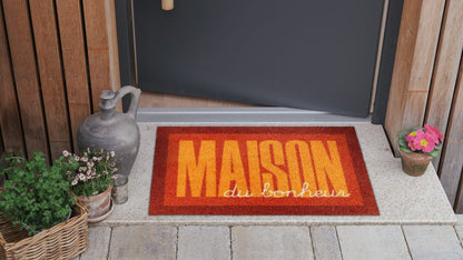 Salonloewe Fußmatte mit Schriftzug „Maison du bonheur“ in Orange und Dunkelrot ambiente