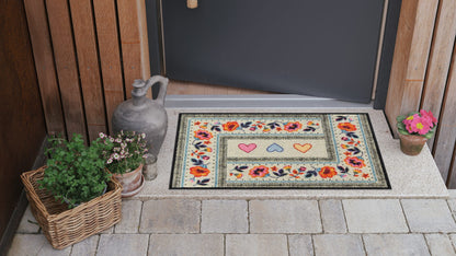 Salonloewe Fußmatte mit drei Herzen und floralem Boho-Muster auf beigem Hintergrund ambiente