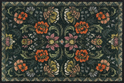 Salonloewe Fußmatte mit symmetrischem Blumenmuster auf dunkelgrünem Hintergrund