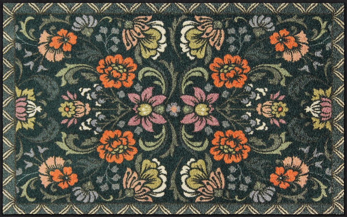 Große Salonloewe Fußmatte mit symmetrischem Blumenmuster auf dunkelgrünem Hintergrund